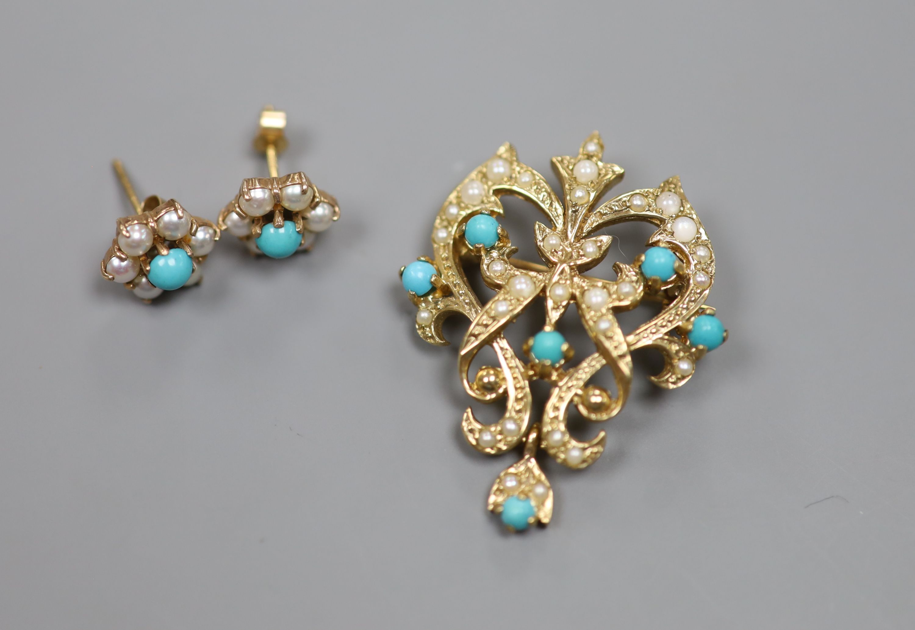 A modern 9ct gold, seed pearl and turquoise set scrolling pendant brooch, 34mm and a pair of matching ear studs